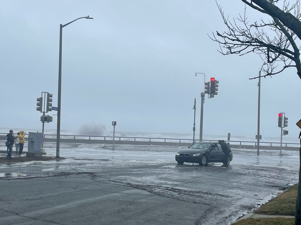 a car is driving through a flooded street (MyCoast AI)
