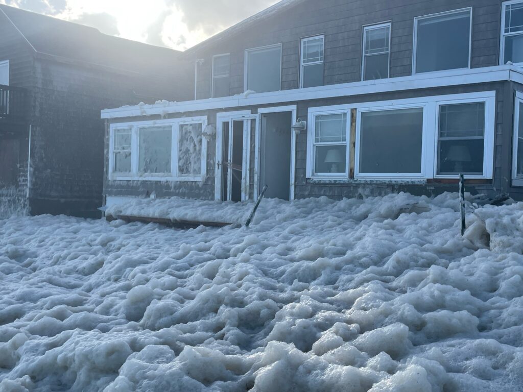a pile of snow in front of a house (MyCoast AI)