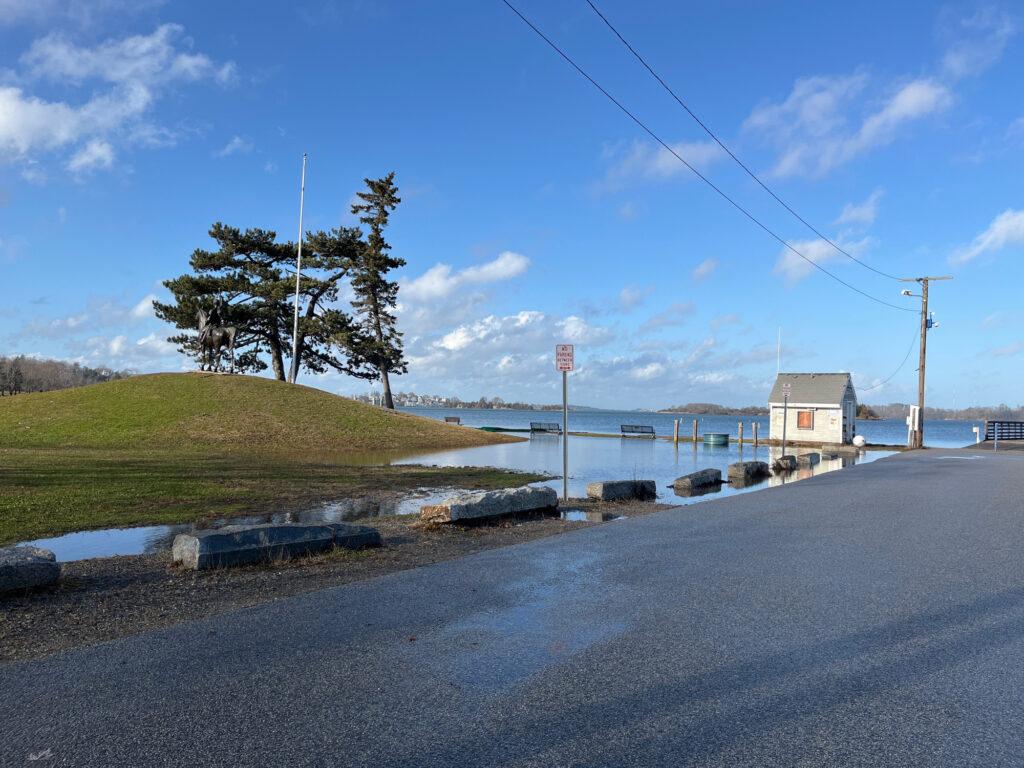 a road with a body of water and grass on the side (MyCoast AI)