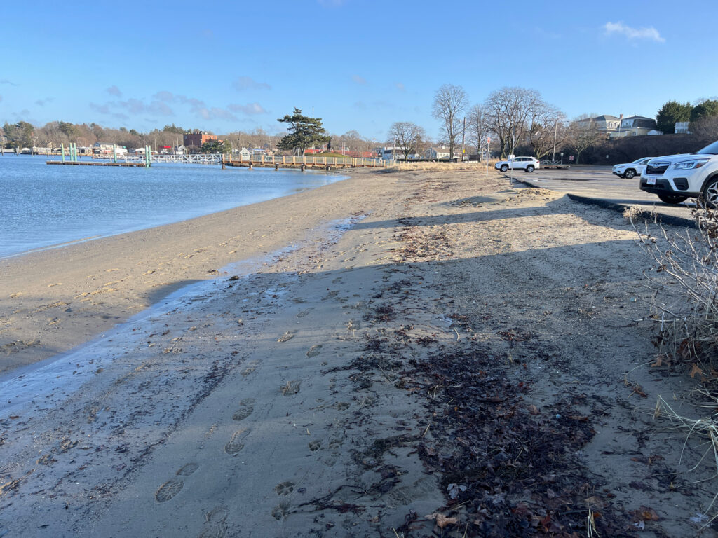 a sandy beach with cars parked on the side (MyCoast AI)