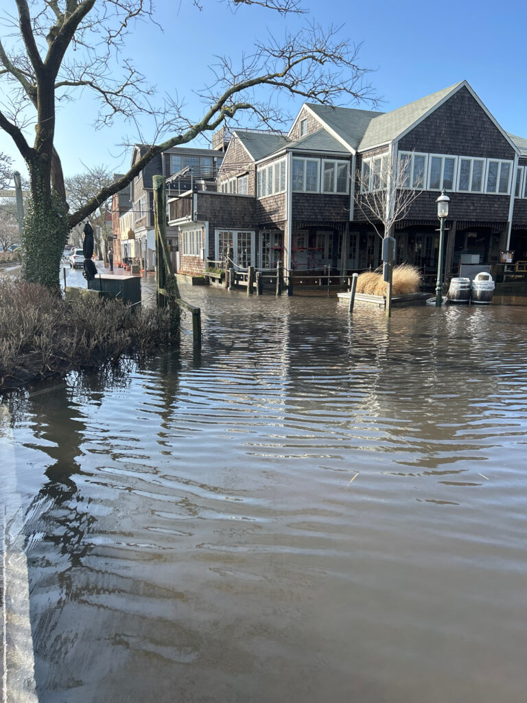 a flooded street with houses (MyCoast AI)