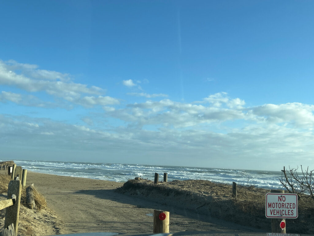 a beach with a sign (MyCoast AI)