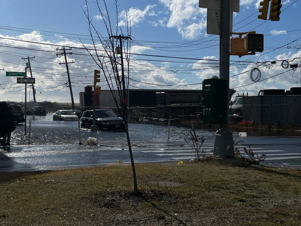 a street corner with a broken light pole and a broken light pole (MyCoast AI)
