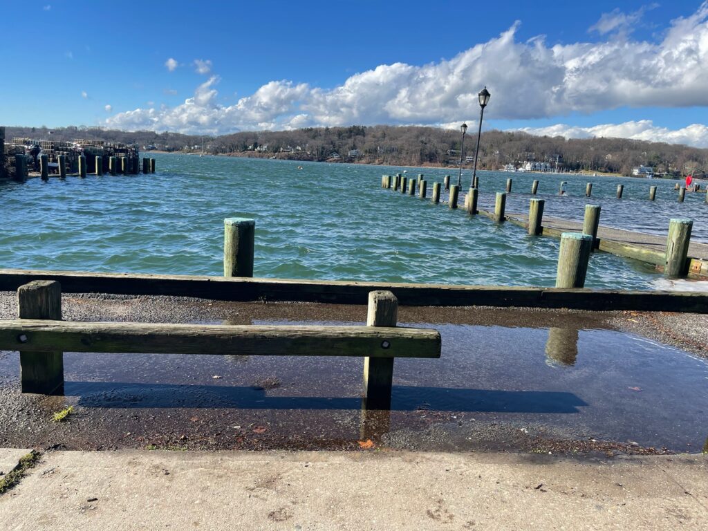 a bench sits by the water (MyCoast AI)