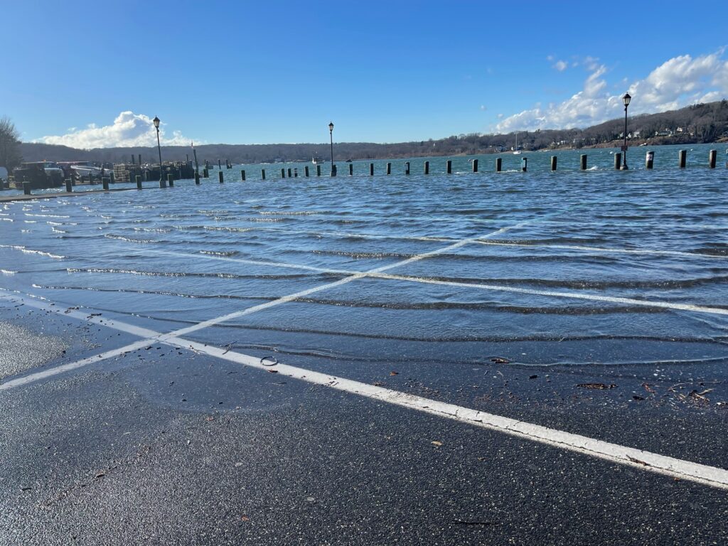 a frozen lake with a bridge in the background (MyCoast AI)