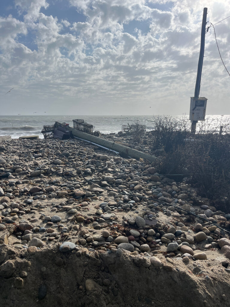 a rocky beach with a tower (MyCoast AI)