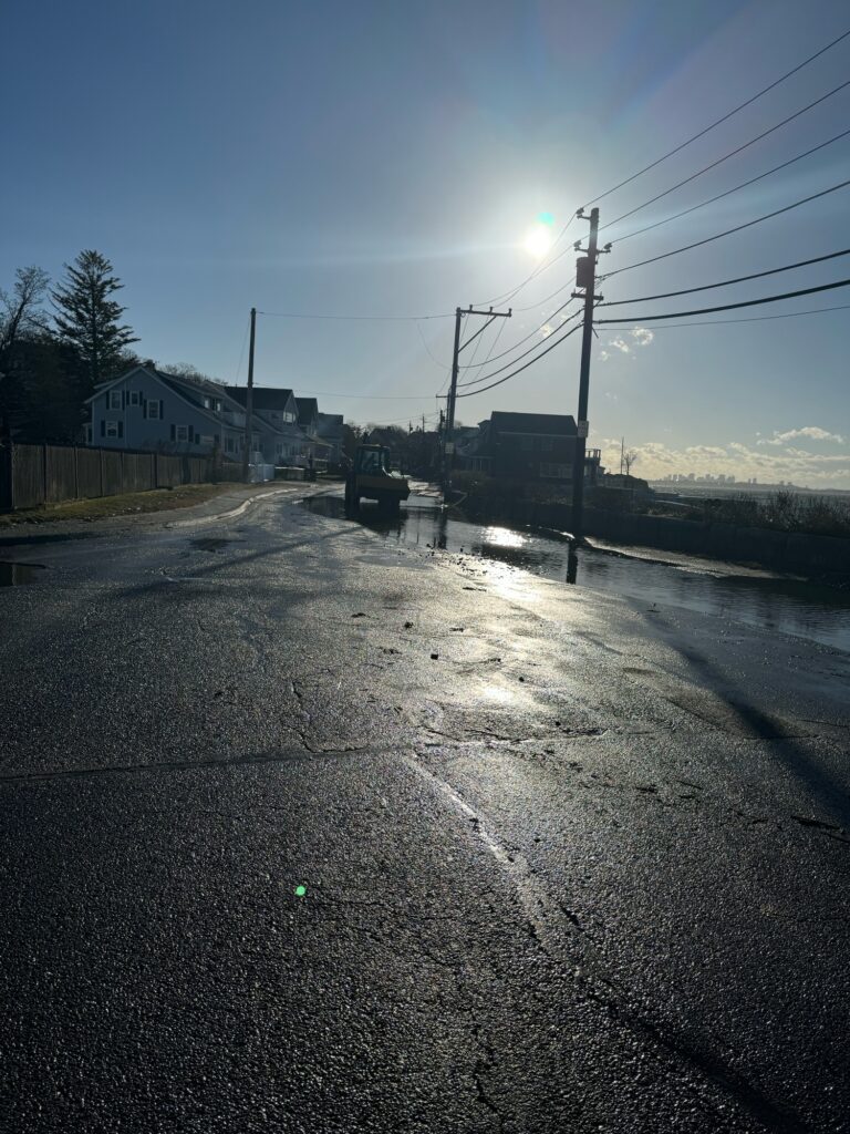 a road with a car on it and a building in the back (MyCoast AI)