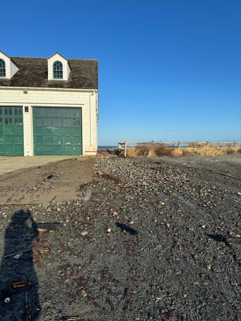 a building with a dirt field in front of it (MyCoast AI)