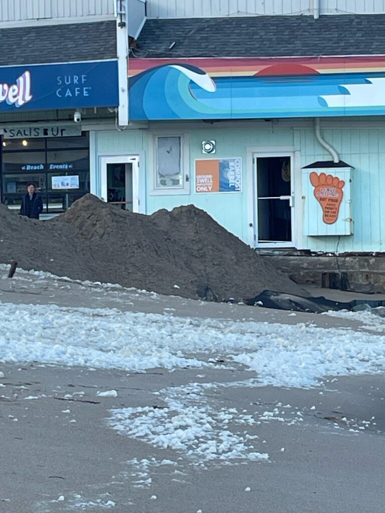 a building with a pile of dirt in front of it (MyCoast AI)