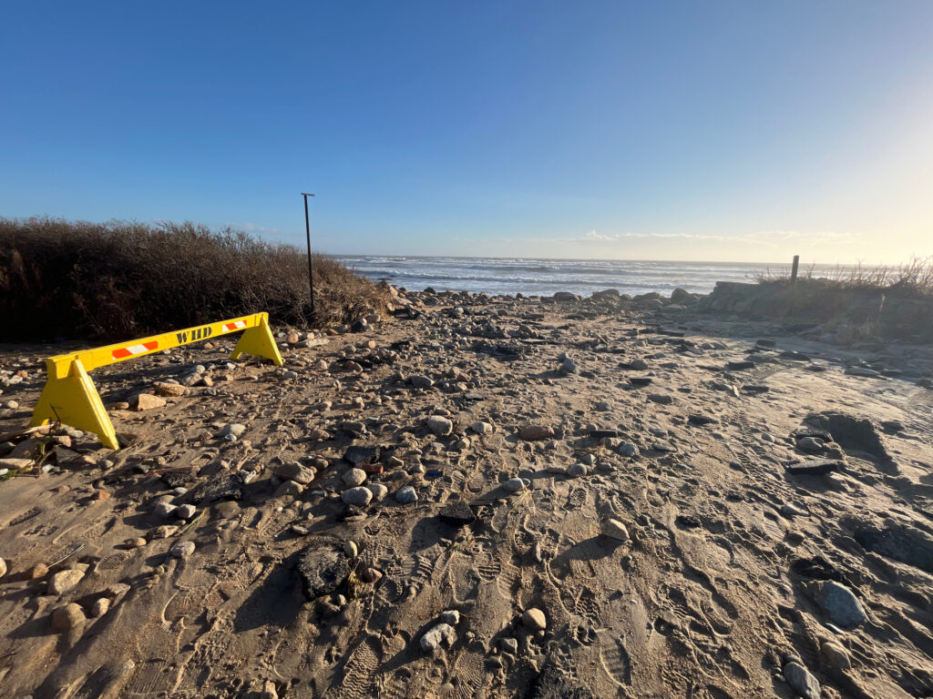 a yellow tape measure on a rocky beach (MyCoast AI)