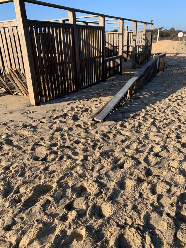 a sandy area with a fence (MyCoast AI)