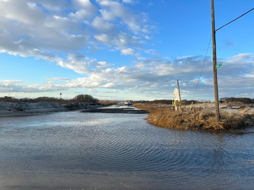 a river with a bridge and a tower in the distance (MyCoast AI)