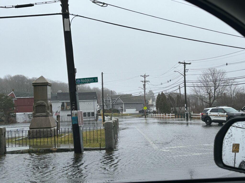 a car driving through a flooded street (MyCoast AI)