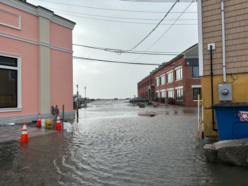 a flooded street with buildings (MyCoast AI)