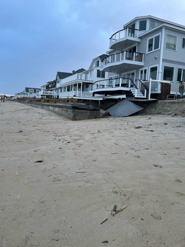 a beach with a row of houses (MyCoast AI)