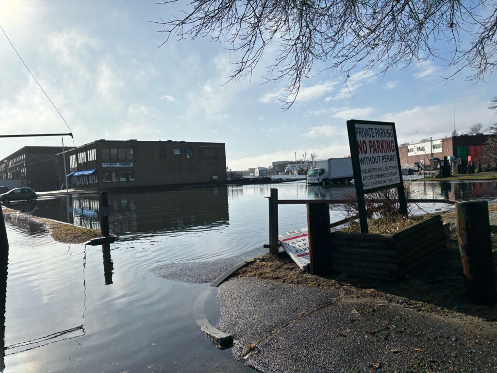 a flooded area with a sign (MyCoast AI)
