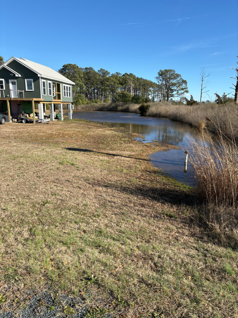 a small pond in a yard (MyCoast AI)