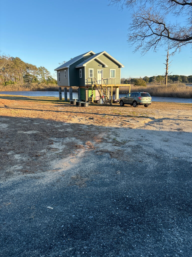 a car parked in front of a house (MyCoast AI)