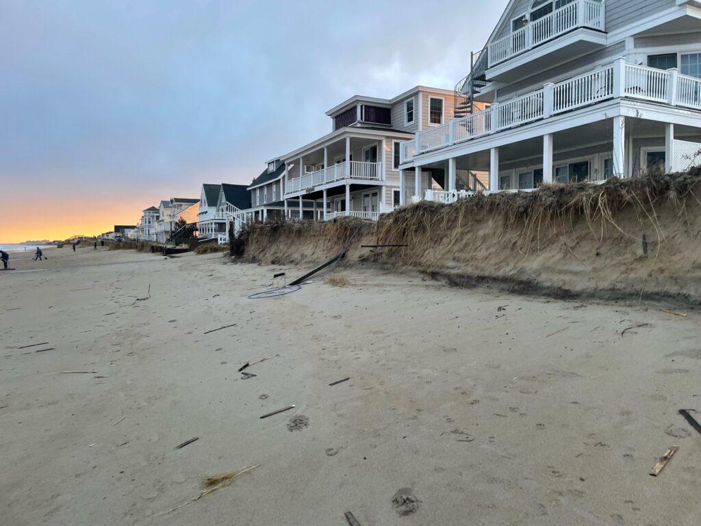 a beach with a row of houses (MyCoast AI)
