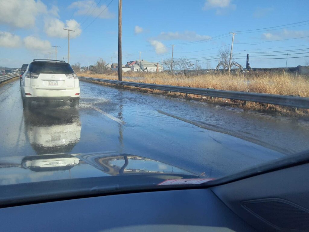 a car driving on a wet road (MyCoast AI)