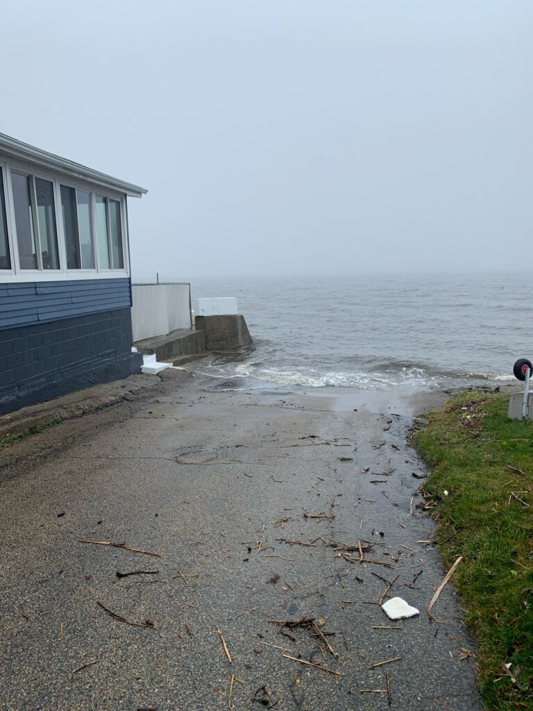 a path next to a building and a body of water (MyCoast AI)