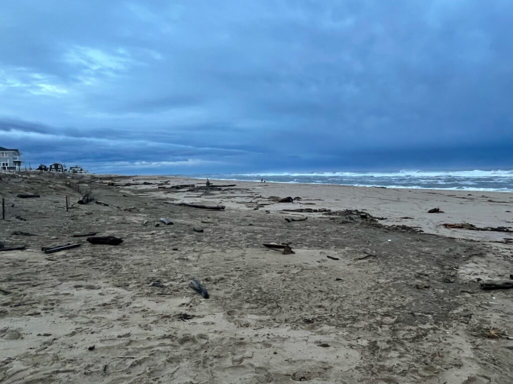 a sandy beach with rocks and water (MyCoast AI)