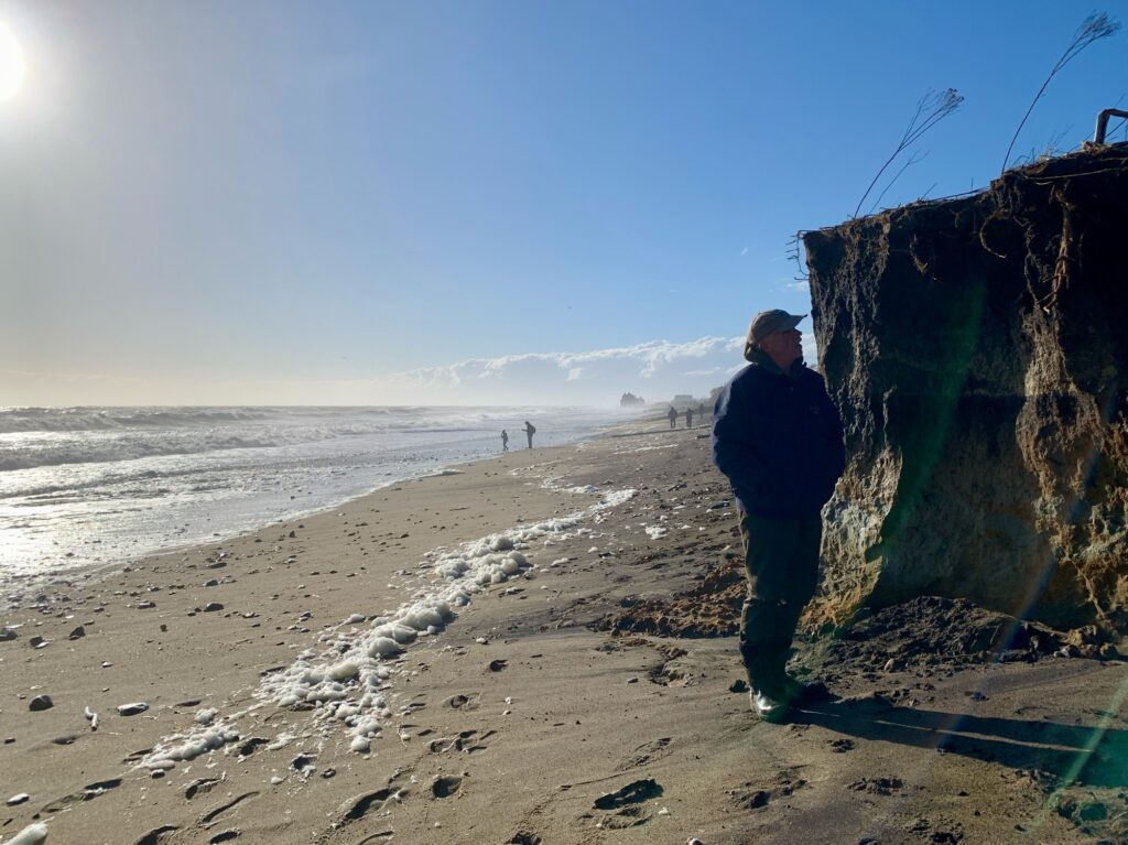 a man standing on a beach (MyCoast AI)