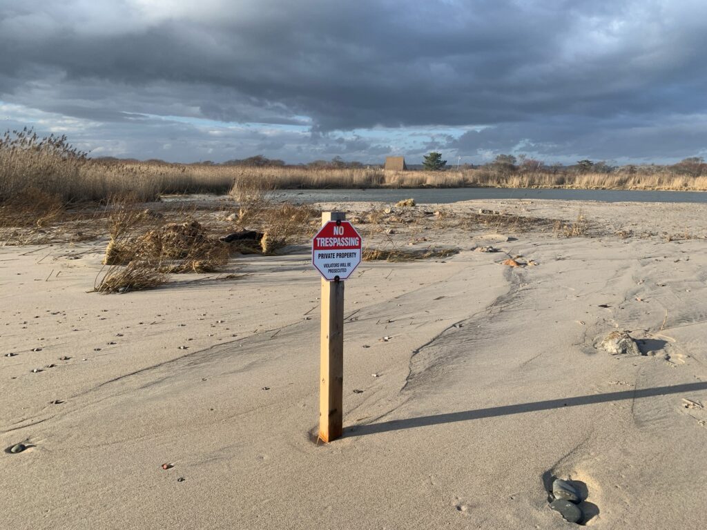 a sign on the beach (MyCoast AI)