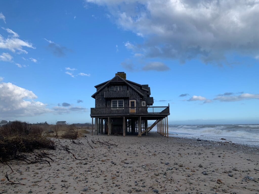a wooden building on a beach (MyCoast AI)