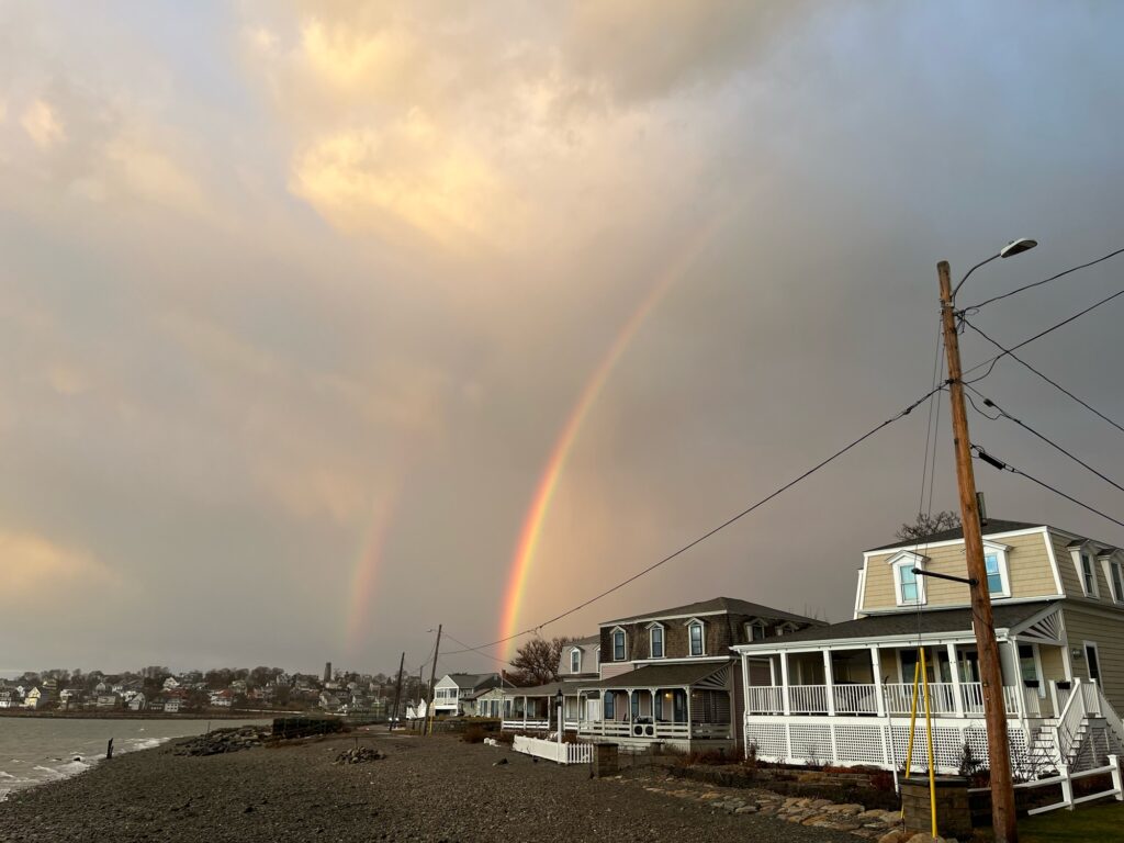 a rainbow over a beach (MyCoast AI)