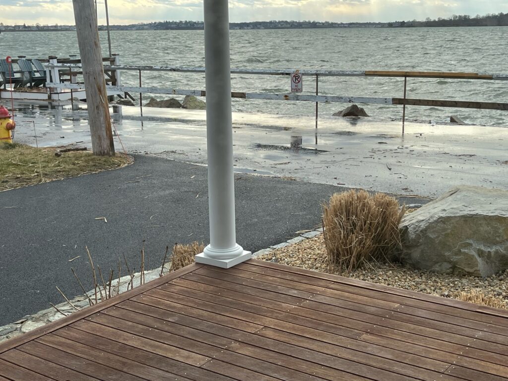 a wood deck next to a body of water (MyCoast AI)