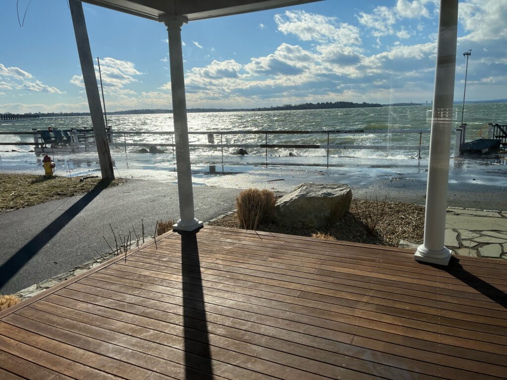 a wooden deck overlooking a beach (MyCoast AI)