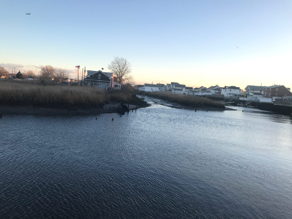 a river with a bridge and buildings (MyCoast AI)