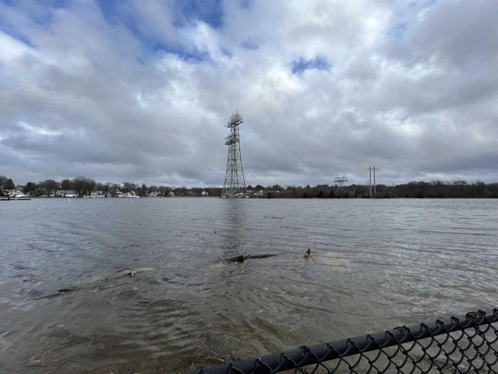 a body of water with a tower in the distance (MyCoast AI)