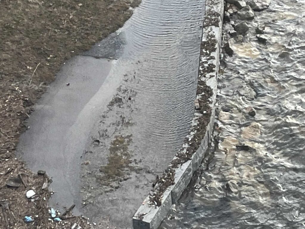 a stream of water with ice and snow on the sides (MyCoast AI)