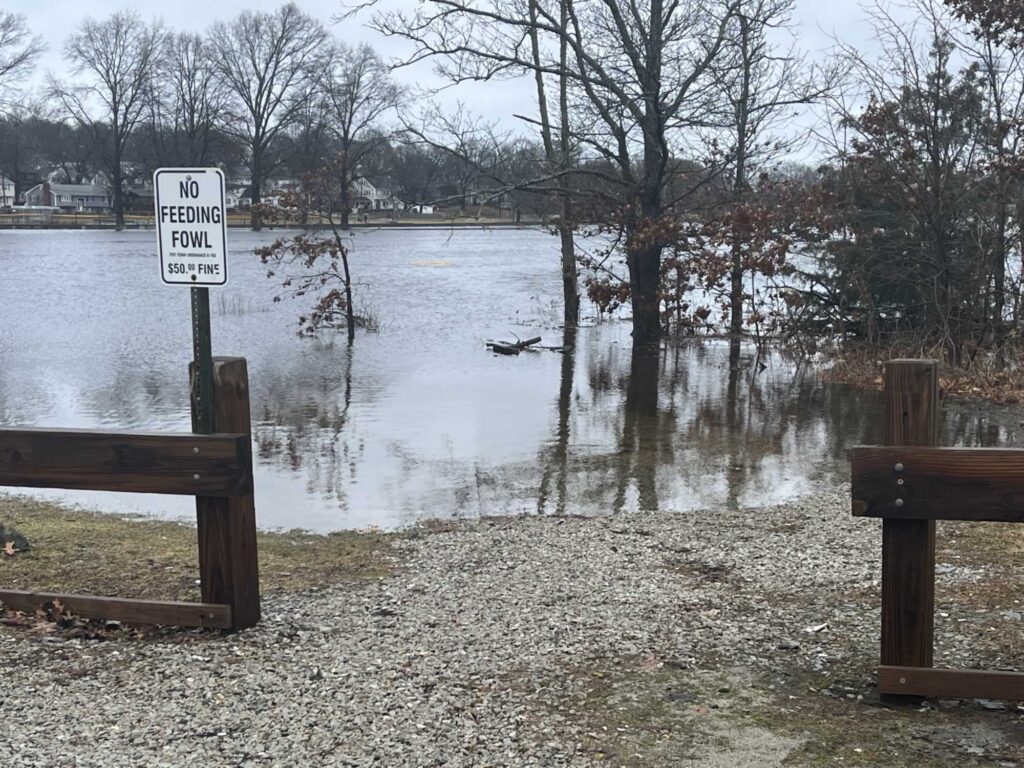 a flooded area with a sign (MyCoast AI)