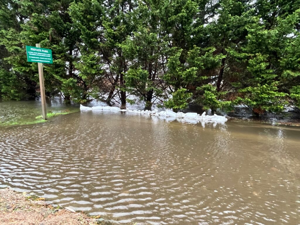 a flooded road with a sign (MyCoast AI)