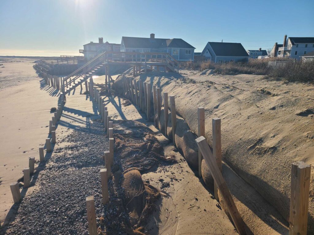 a fenced off area with houses in the background (MyCoast AI)