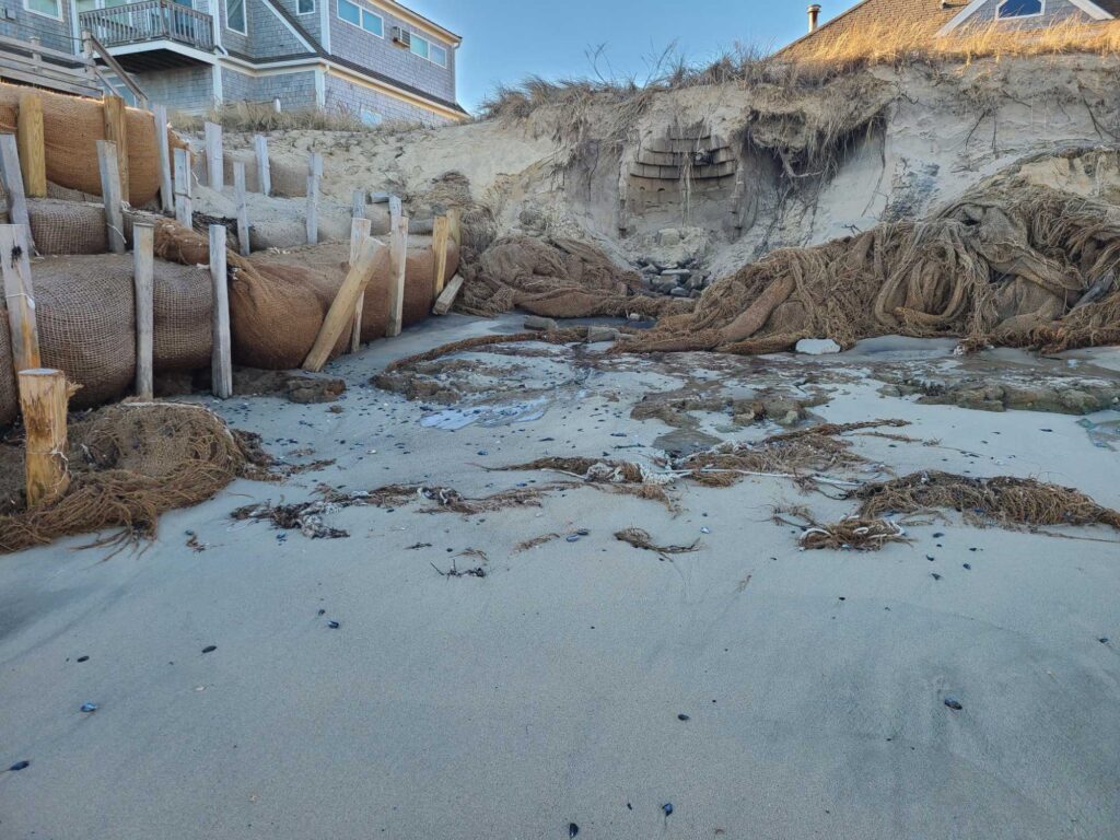 a sandy beach with a fence (MyCoast AI)