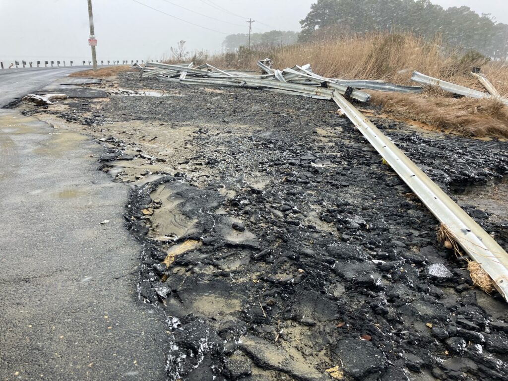 a road with a pipe and debris on the side (MyCoast AI)