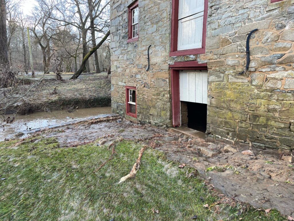 a brick building with a small pond (MyCoast AI)