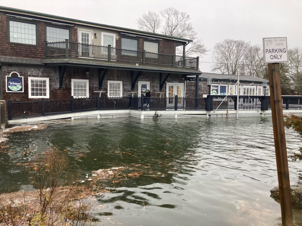 a flooded street with a building (MyCoast AI)