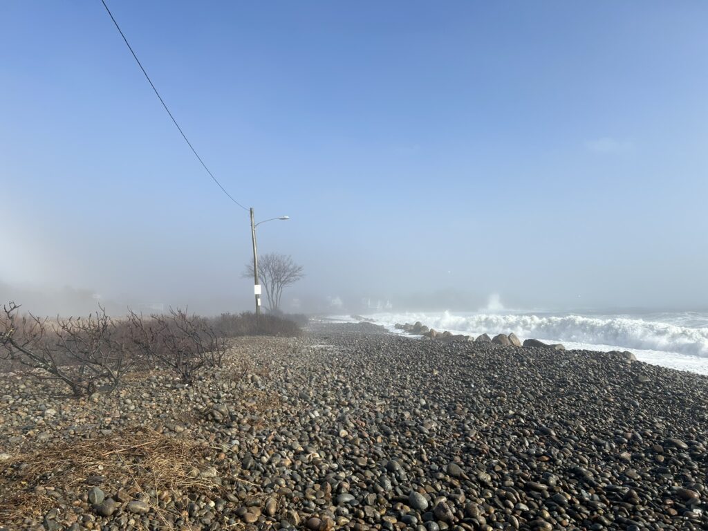 a rocky beach with power lines (MyCoast AI)