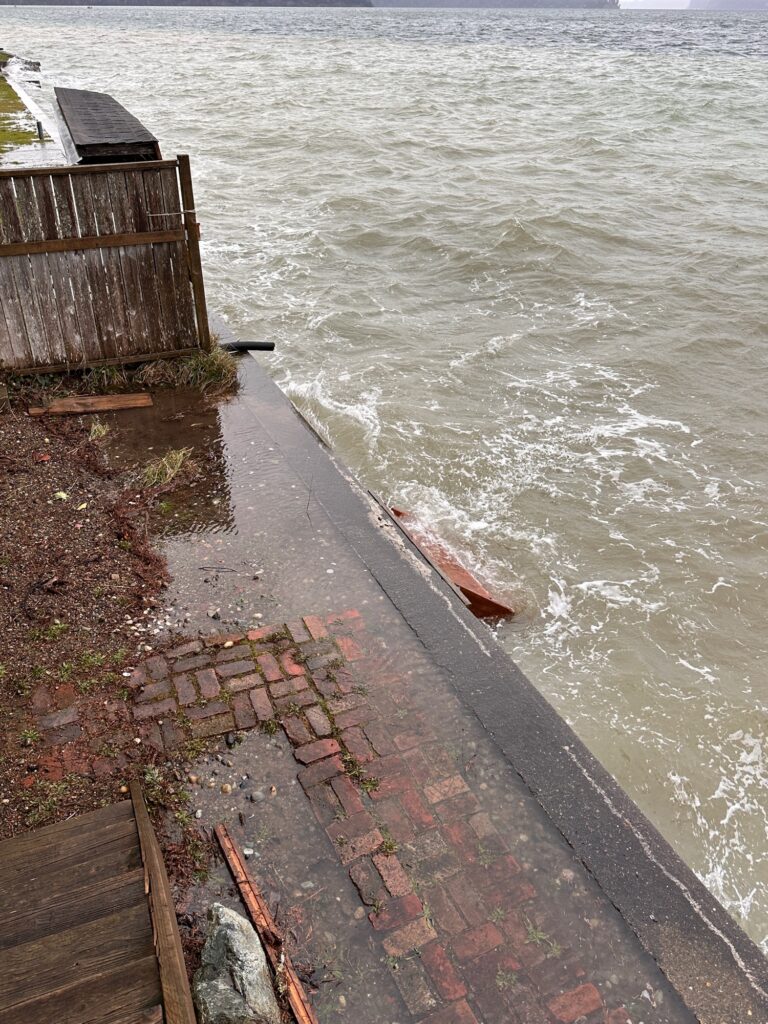a brick walkway next to a body of water (MyCoast AI)