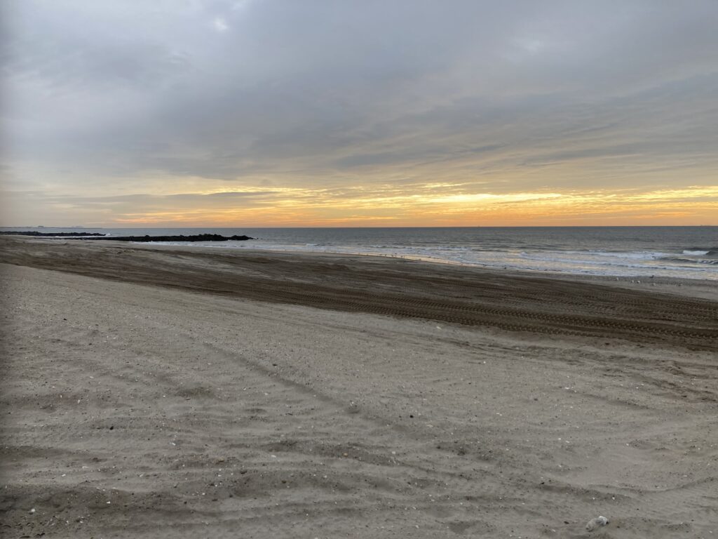 a beach with waves crashing on it (MyCoast AI)