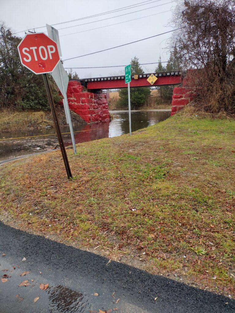 a stop sign on the side of a road (MyCoast AI)