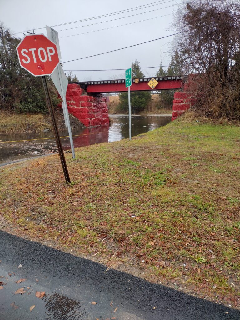 a stop sign on the side of a road (MyCoast AI)