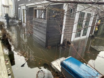 a flooded street with a building on the other side (MyCoast AI)