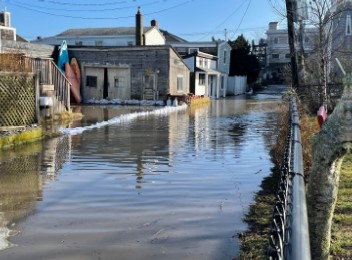 a flooded street with houses (MyCoast AI)