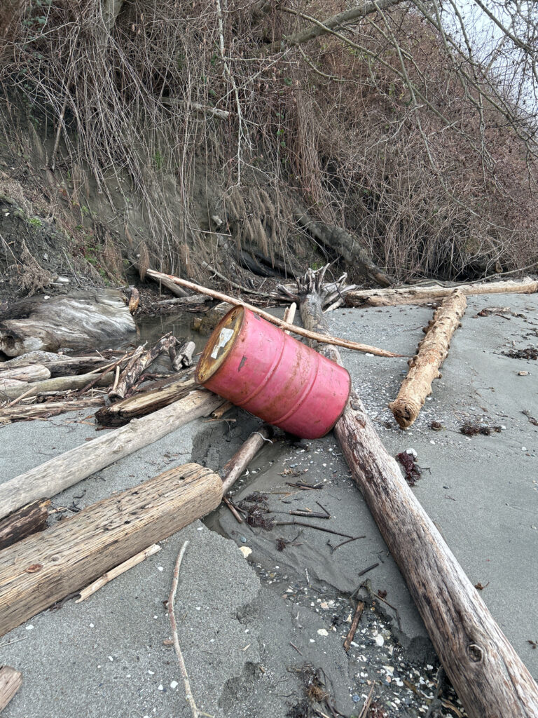 a red bucket on a wooden surface (MyCoast AI)
